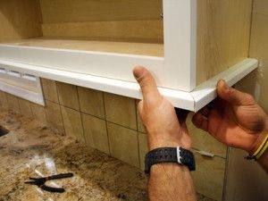 Upgrade those builder grade cabinets by adding some molding to the cabinets