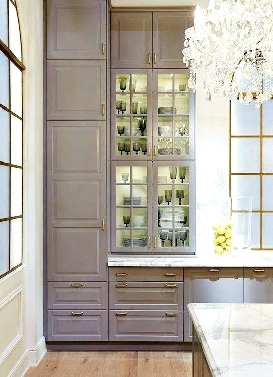 Dark Hardwood Kitchen Flooring Under Tall White Kitchen Cabinet With Glass Door Upper Cabinets And
