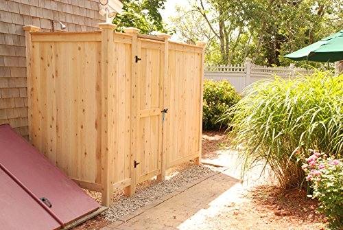 Cute, beachy outdoor shower with surfboard accents