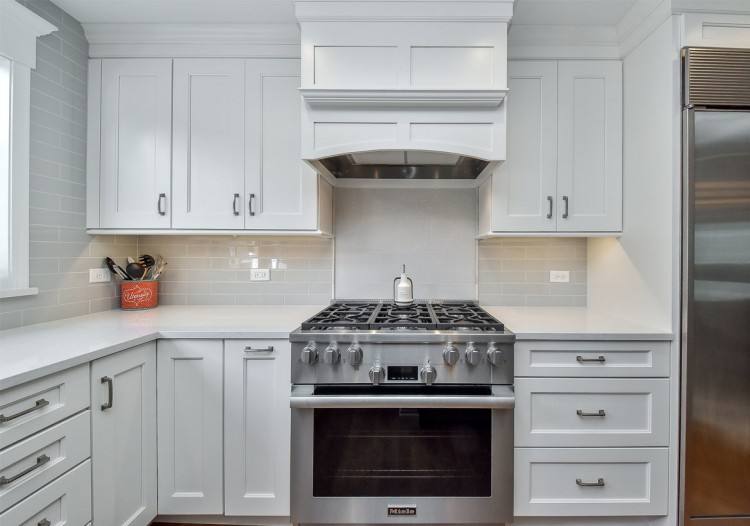 Dodie Thayer lettuceware contrasts beautifully with the white shelving and  cabinetry in the upstate New York kitchen of lighting designer Christopher