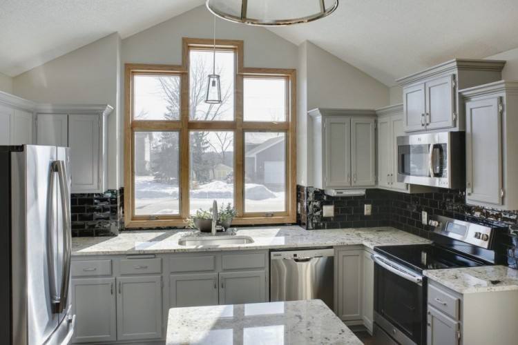 Off White Cabinets with Glaze in a Traditional Kitchen