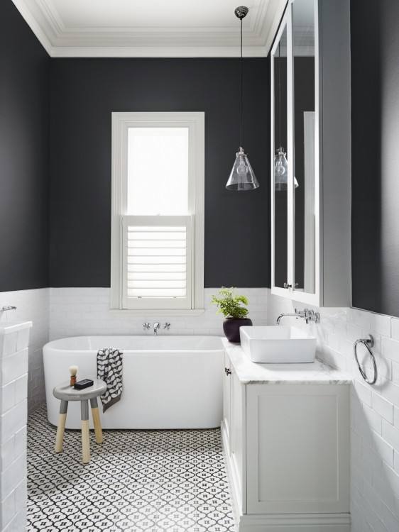 dark grey floor tiles, large wall mirror, two white sinks, inbuilt bath with Bathrooms Without Tiles – 50 Alternative Design Ideas