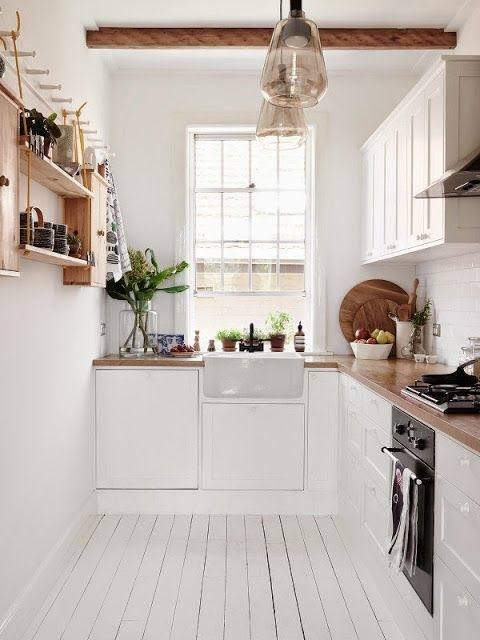 Add some black to the narrow Scandinavian kitchen [Design: Texas Construction Company]