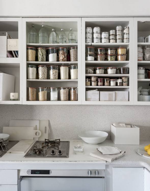 It is absolutely unbelievable what a difference painting our kitchen  cabinets white made