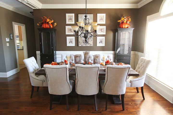 table against the wall, two chairs, one bench seat