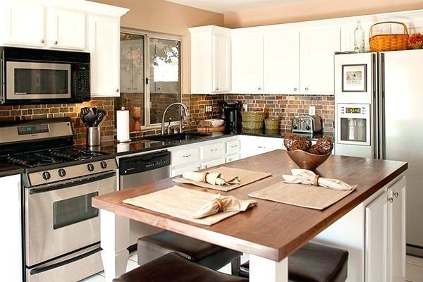 Transitional kitchen with hardwood floor and pendant lights