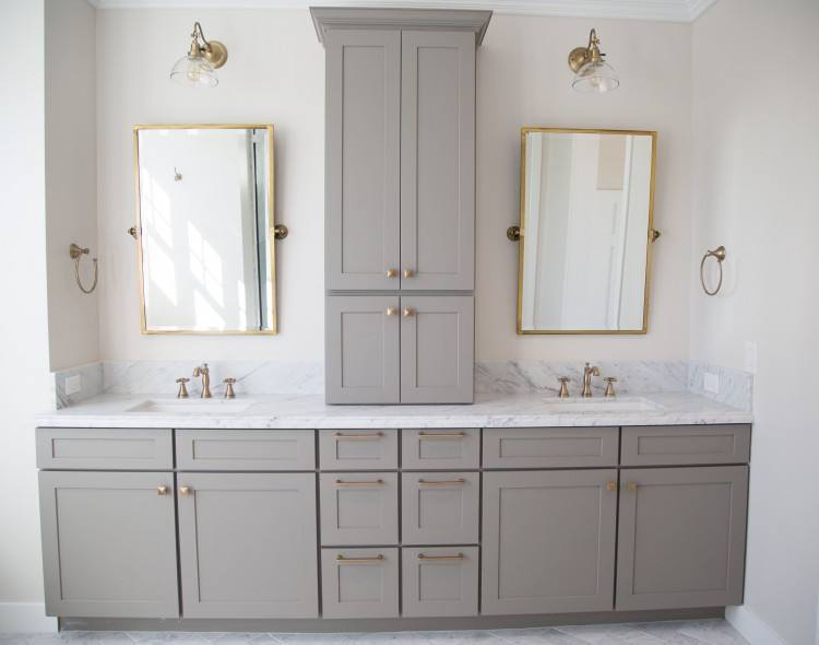 Carrara marble and grey master bathroom with antique brass accents by Rafterhouse