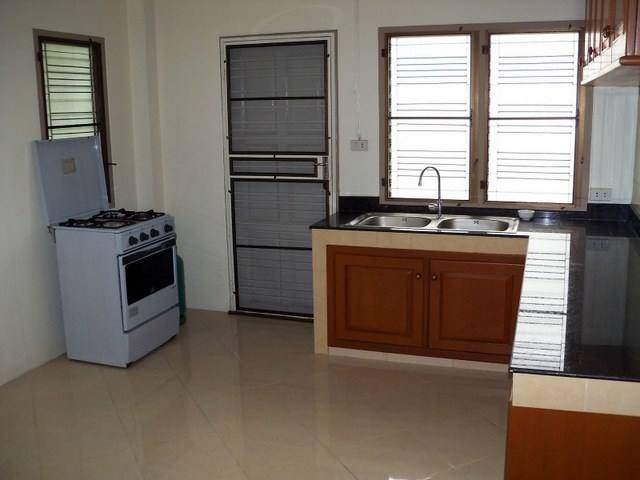 Concrete frame, tiled top and sides and cupboard doors set into the fronts