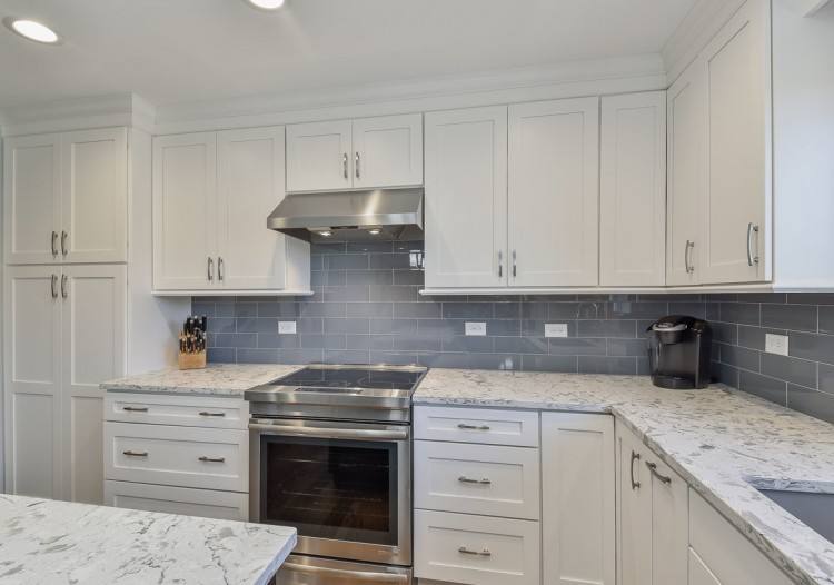 White Shaker kitchen cabinets in the Arbor door style