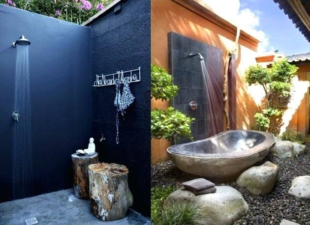 Outdoor shower area with stone wall