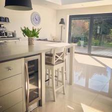 Kitchen with a honeycomb mosaic tile backsplash in a variety of shades