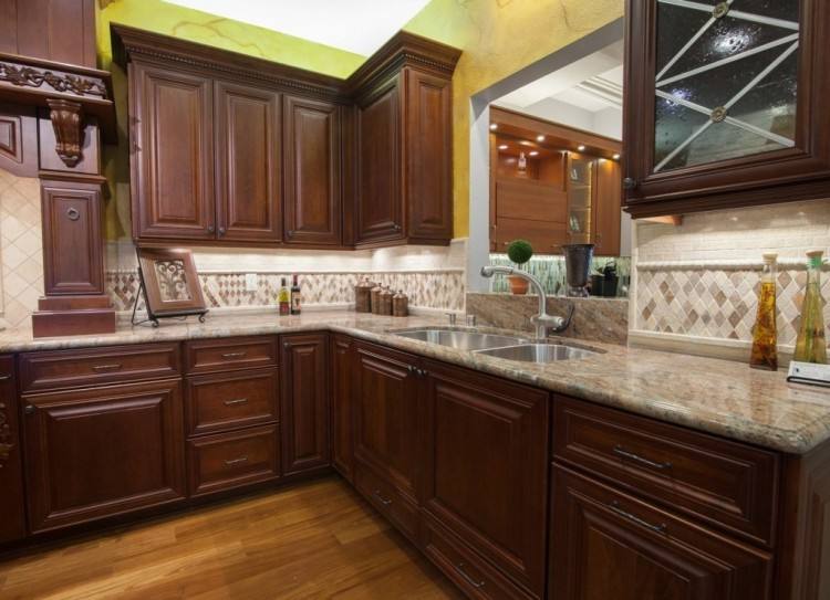 Gorgeous open kitchen with Mediterranean inspired details | White cabinets, cement tile backsplash, tall ceilings, wood accents | by Ventura Homes in