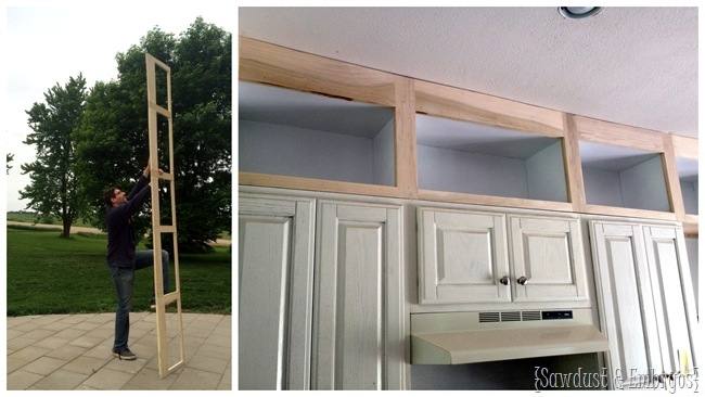 Beautiful kitchen features a wall of floor to ceiling pantry cabinets fitted with double ovens and an under cabinet refrigerator