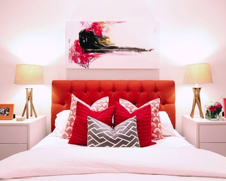 Make a clean and minimalistic red bedroom design by painting your walls red and using all white furniture and decor