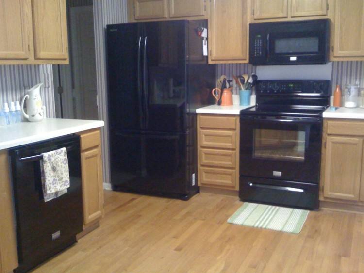 black appliances to cut down on finger prints with stainless steel | Home | Kitchen, Black appliances, Grey cabinets