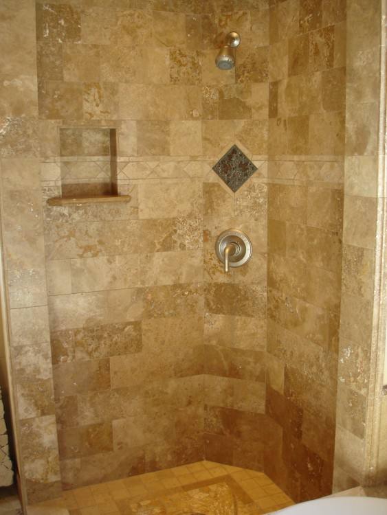 I like that the shower is open, and that the floor tile extends all the way up the back shower wall