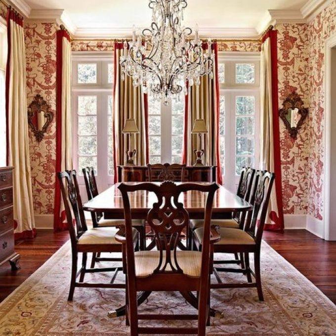 floral drapes and beautiful red walls bring the Victorian dining room alive [