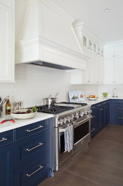 A light wood floor and white tile backsplash will help brighten the room while allowing gray cabinets to become the centerpiece of the design